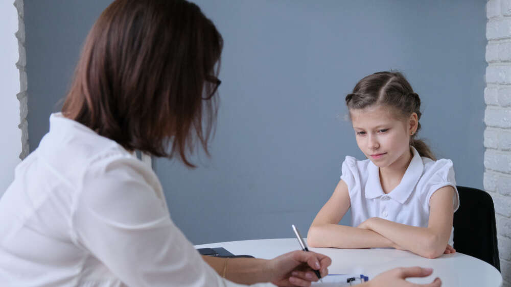 A tutor teaching her student at her home representing the concept of home tutoring or home-based learning